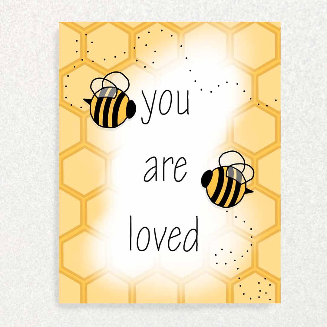 Front of you are loved positive affirmation card has a couple of cute bumblebees in front of a honeycomb background