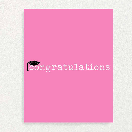 Front of Graduation Cards says, “congratulations” with little graduation cap in front of Barbie pink background giving Barbie and Kenergy Vibes