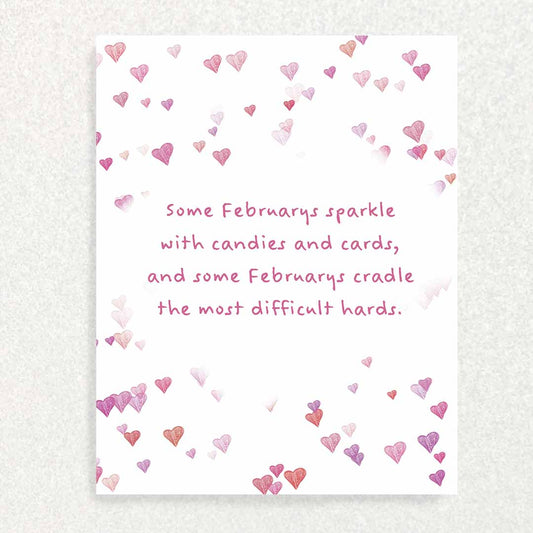 Front of February Anniversary of Loss Sympathy Card a scattering of pink hearts on white background