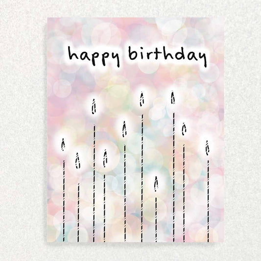 Front of Pink Candles Birthday Keepsake Interview Prompt Card several lit candles with "happy birthday" greeting in front of pastel rainbow background