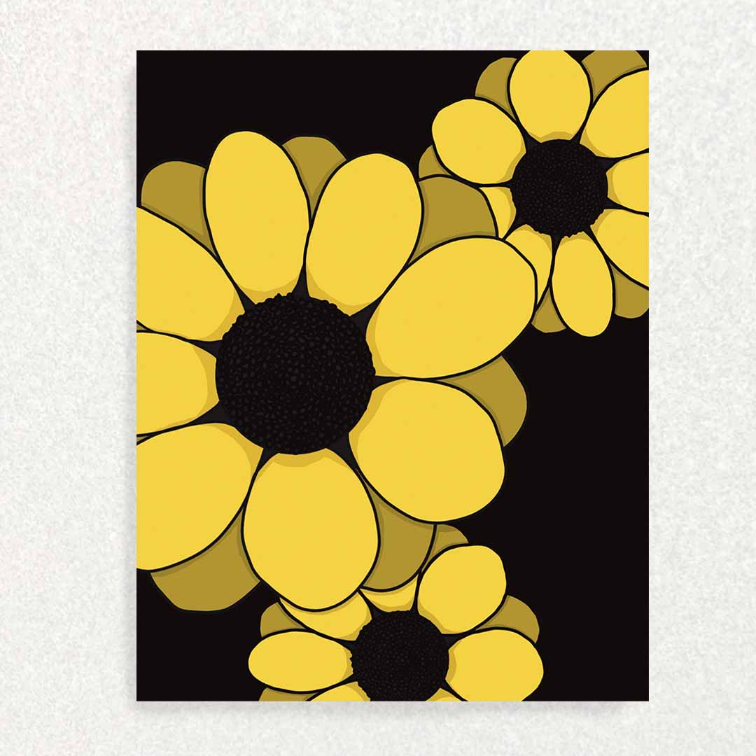 Three stunning sunflowers in front of black background